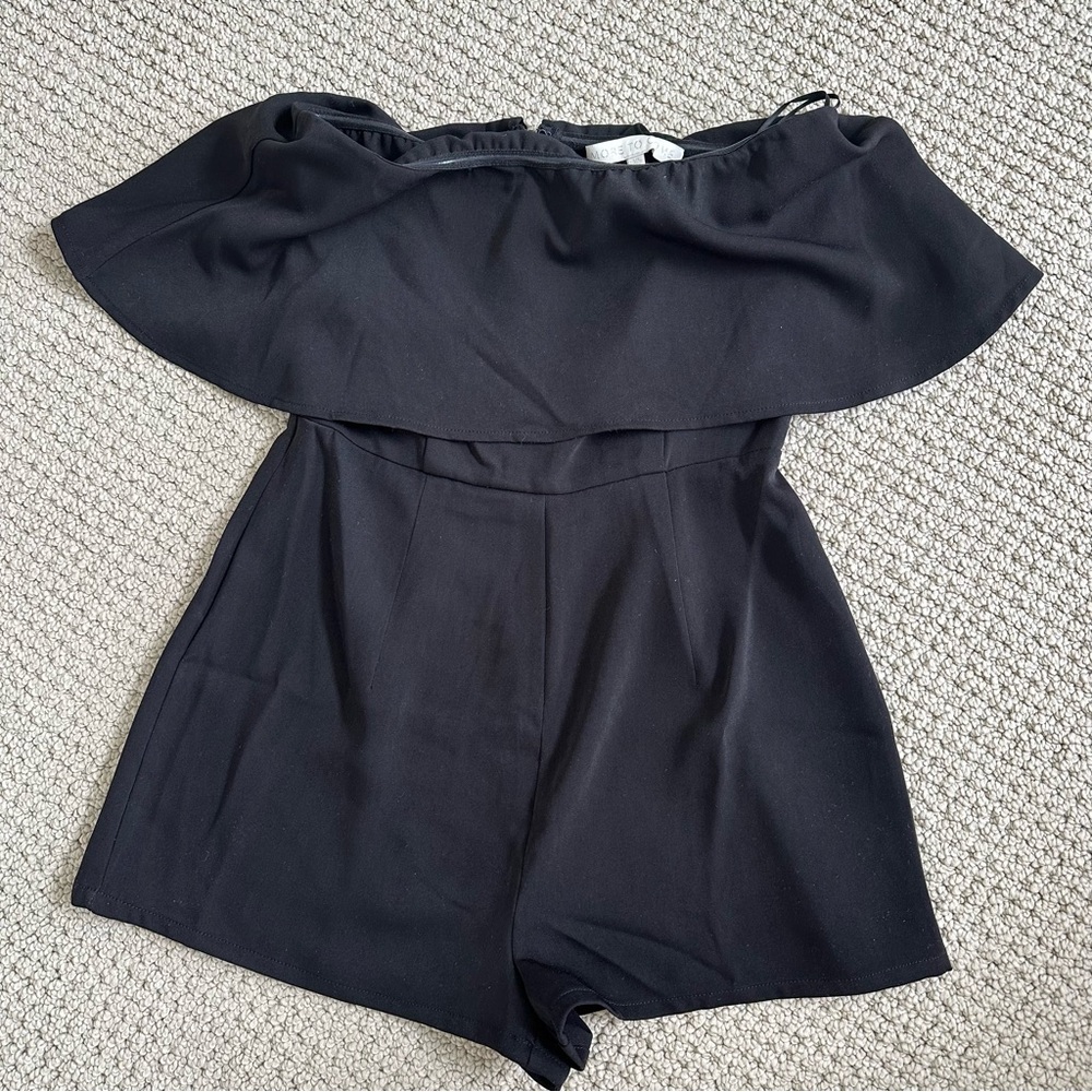 XS Black Strapless Ruffle Romper from Revolve